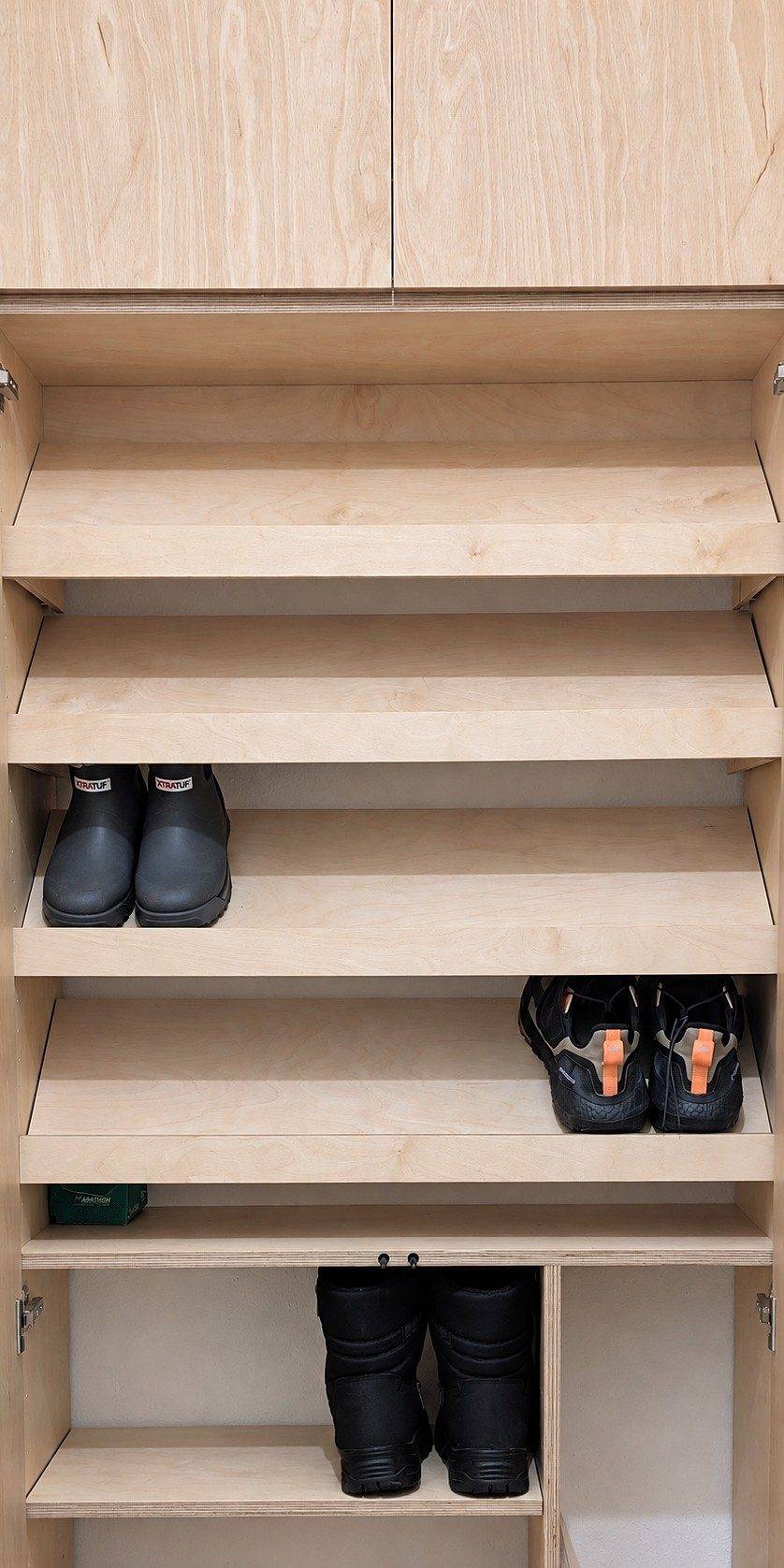 Close-up of the angled shoe shelves, with boots and shoes in place