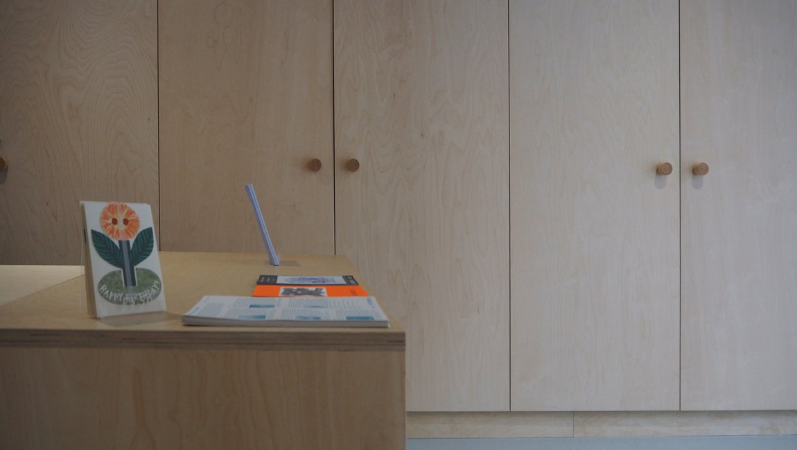 The reception desk, with cards and stock laid out on the counter