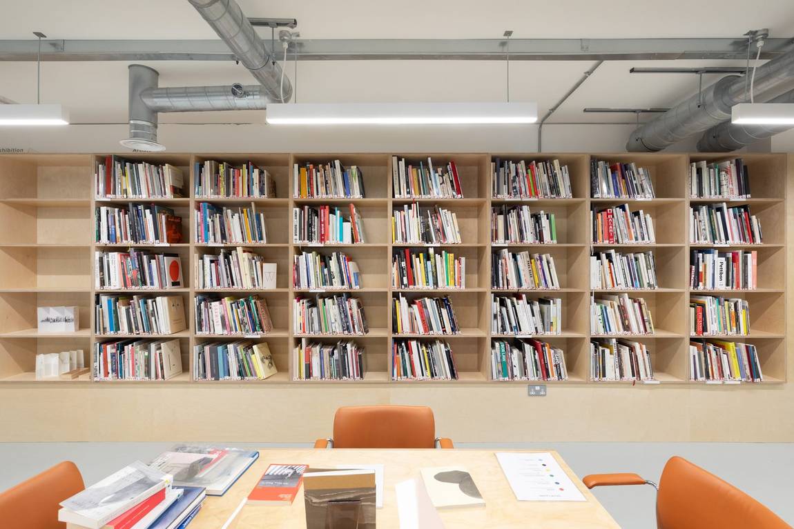A corner of the library shelving, with exhibition catalogues on the end bay