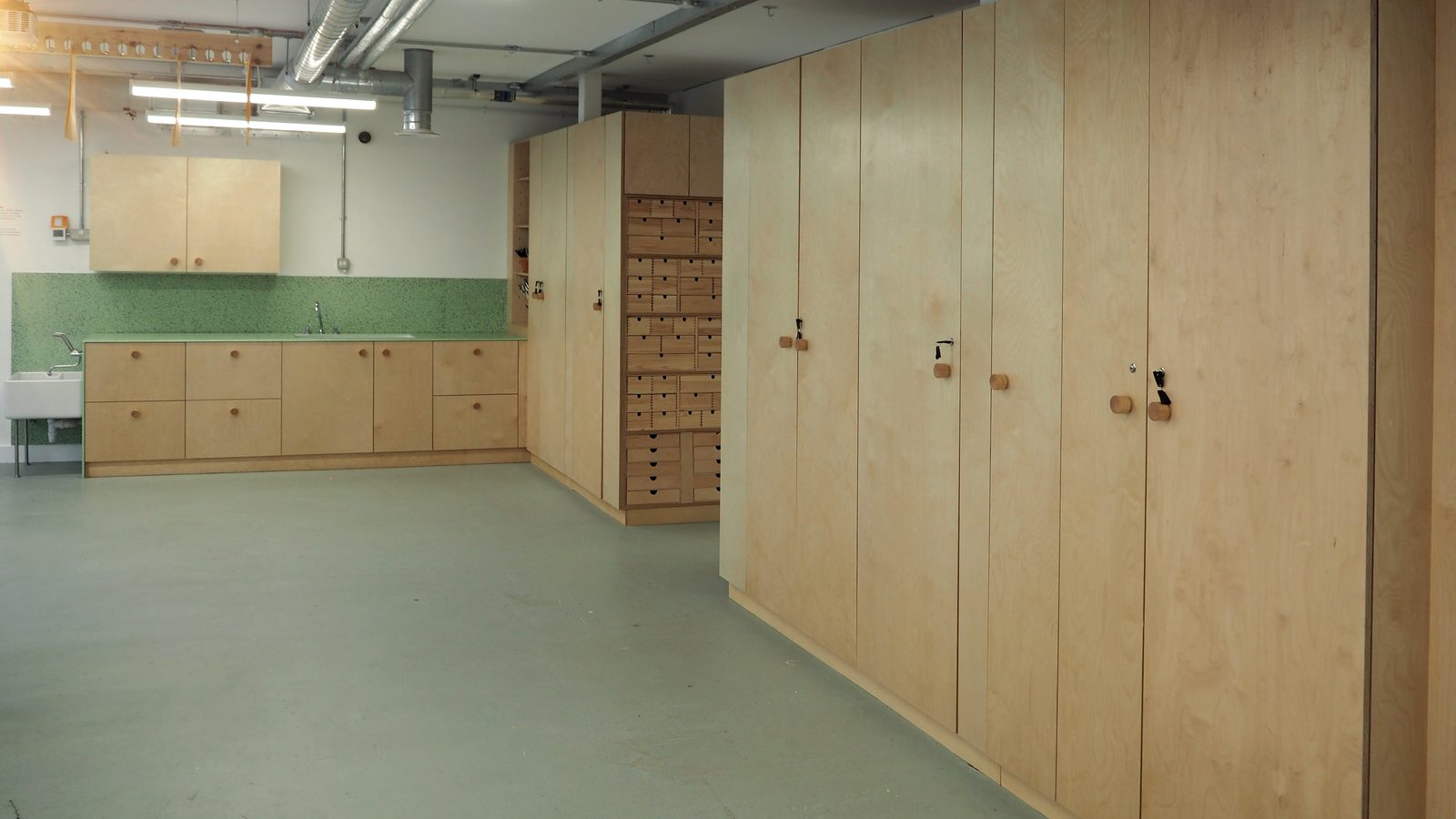 Close-up of the education room drawers, dovetailed in plywood